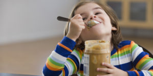 Kid Eating Peanut Butter